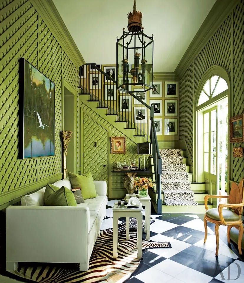 L-shaped stairs ,In a New Orleans home, the staircase, softened with a leopard-print runner, is decorated with Richard Avedon and Bill King photographs from Blackglama ads that homeowner and retired ad executive Peter Rogers masterminded.